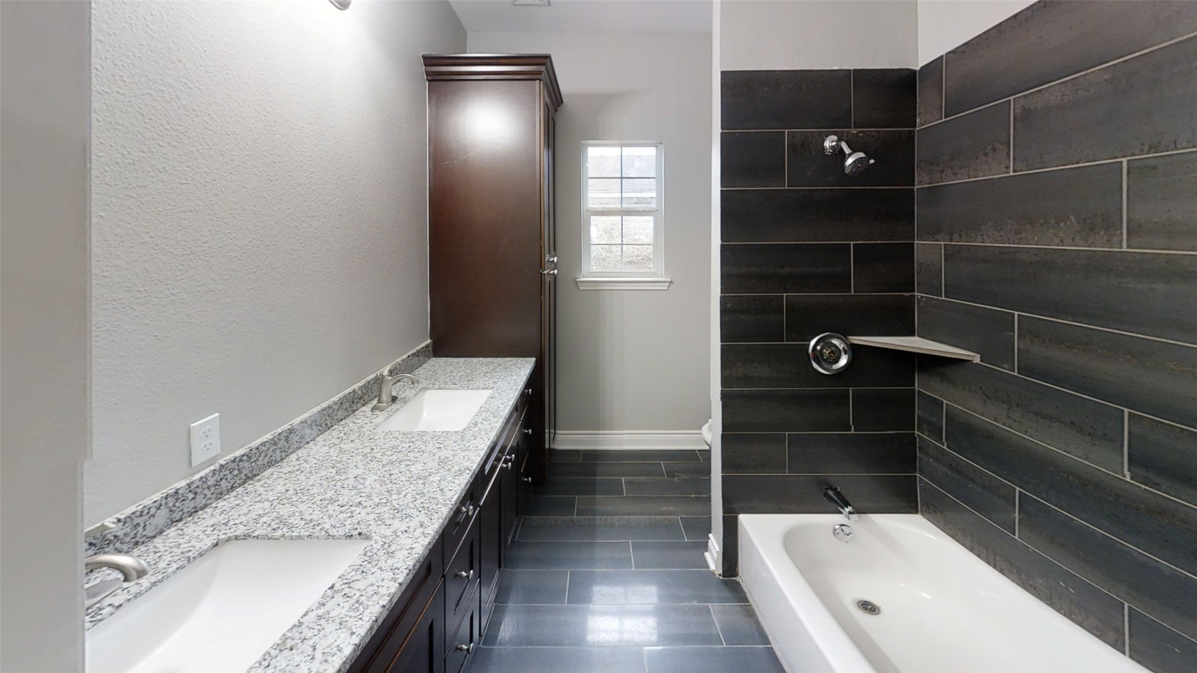 4323 Alice Street Houston, TX 77021 - Photo 6 of 11 a bathroom with a granite countertop sink a toilet and shower
