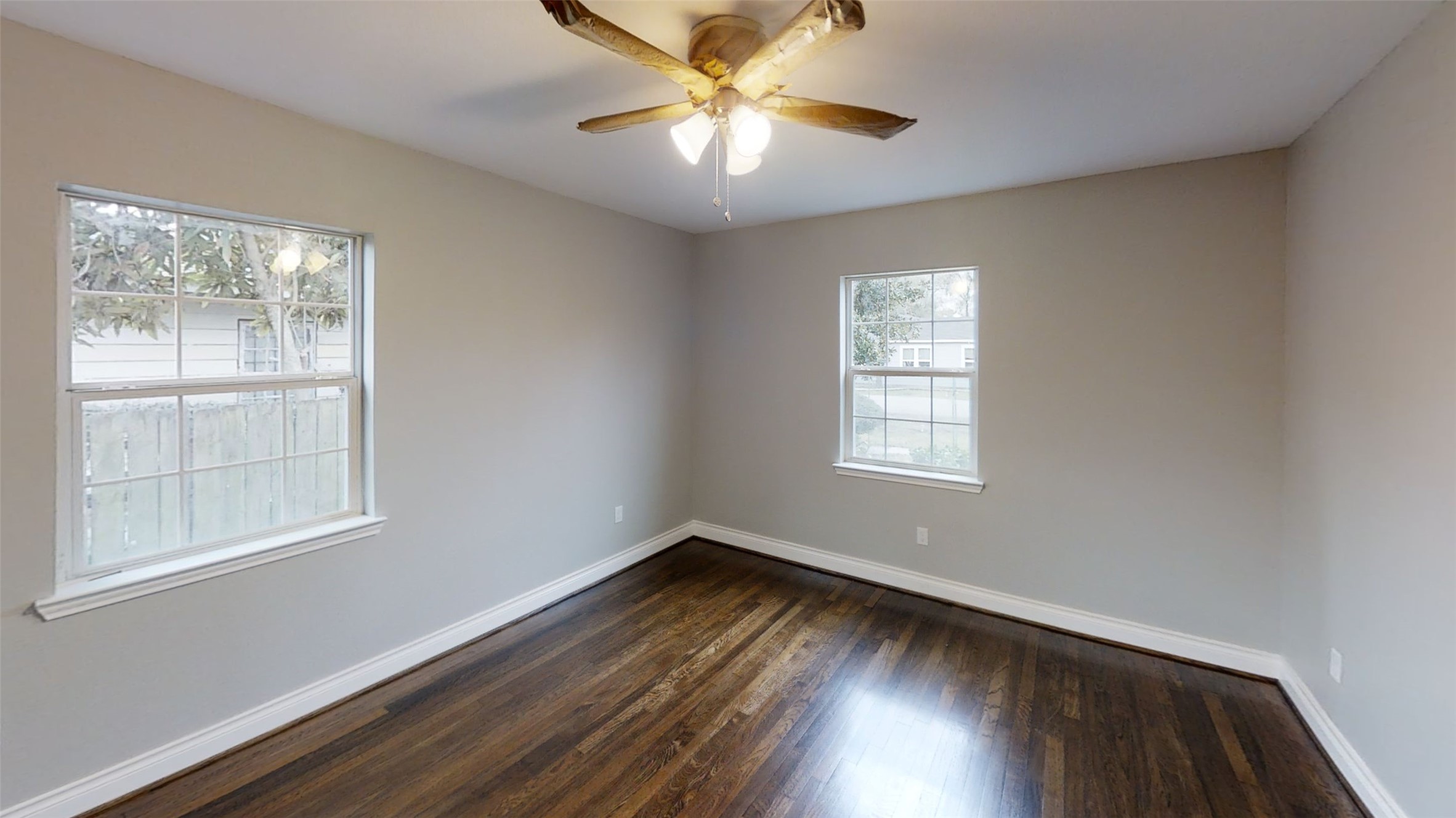 4323 Alice Street Houston, TX 77021 - Photo 7 of 11 a view of empty room with wooden floor and fan