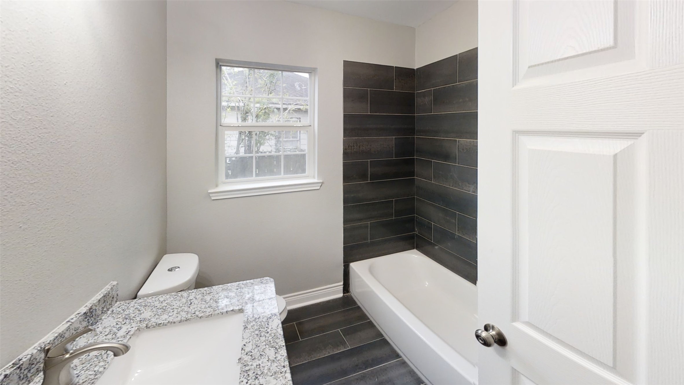 4323 Alice Street Houston, TX 77021 - Photo 9 of 11 a bathroom with a bathtub