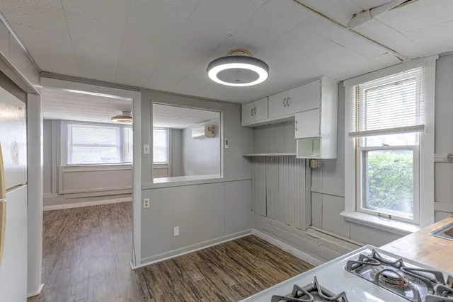 a stove top oven sitting inside of a kitchen