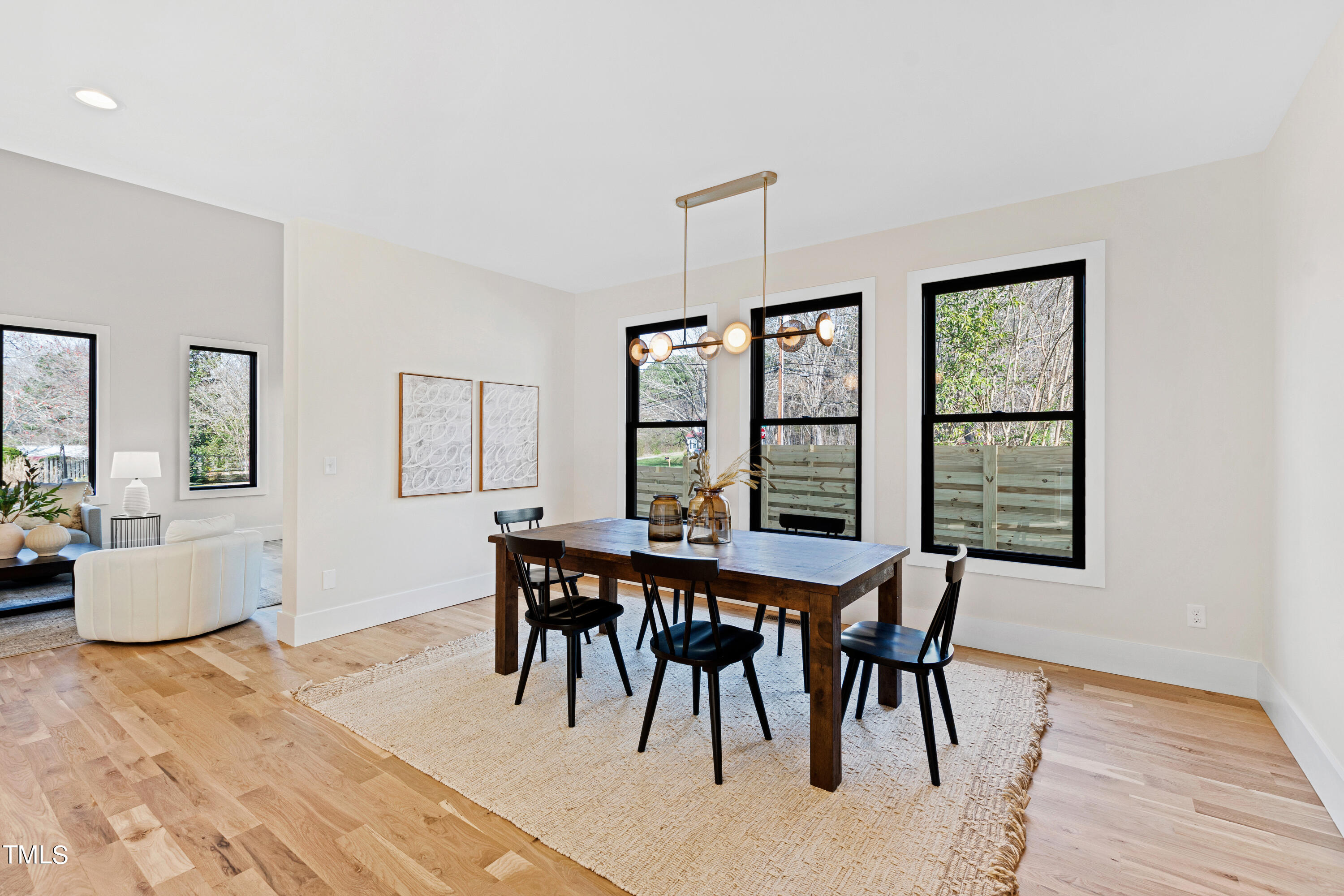 107 Gary Road Carrboro, NC 27510 - Photo 14 of 34 a view of a dining room with furniture window and wooden floor