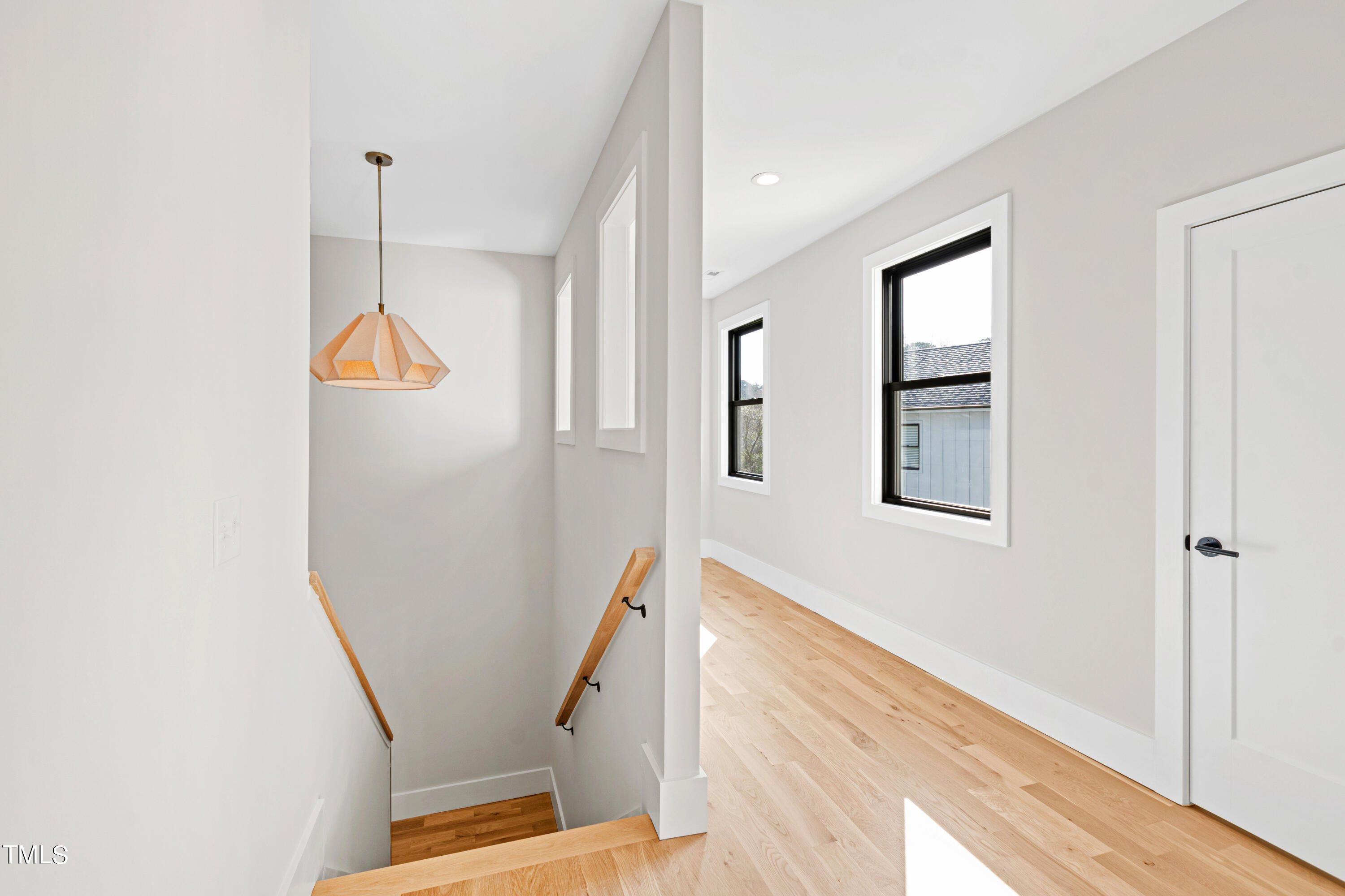 107 Gary Road Carrboro, NC 27510 - Photo 16 of 34 a view of a hallway with windows