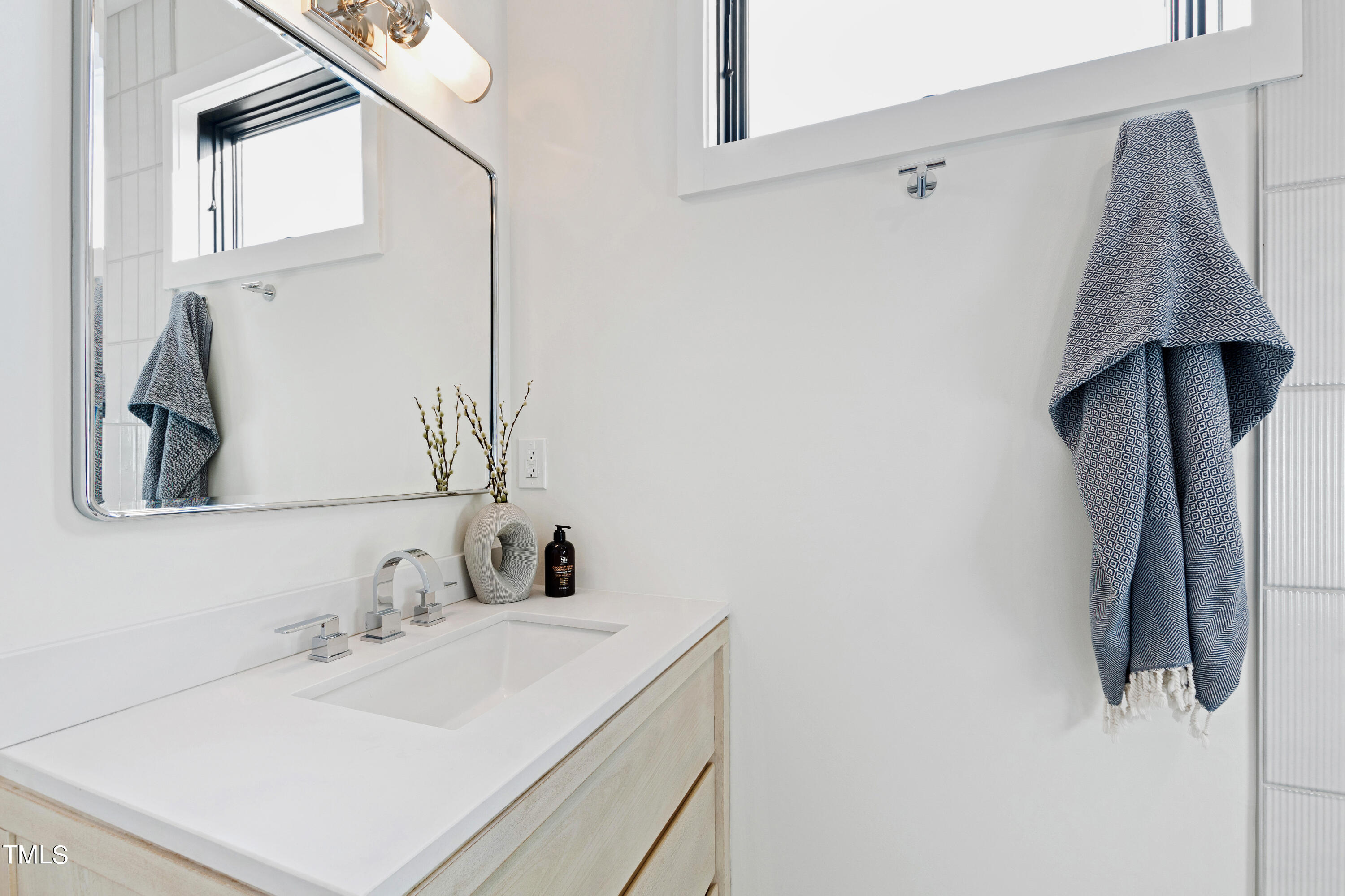 107 Gary Road Carrboro, NC 27510 - Photo 24 of 34 a bathroom with a sink and a mirror