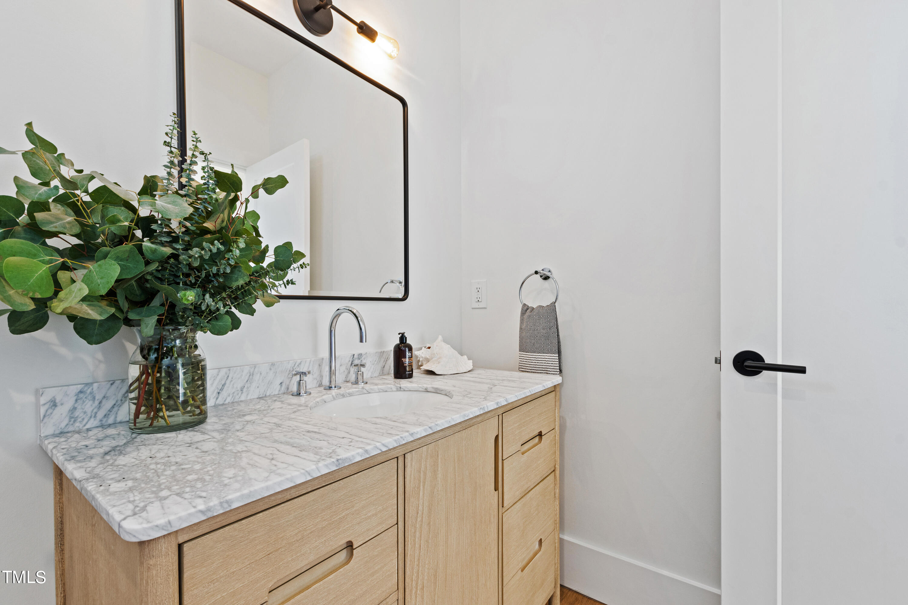 107 Gary Road Carrboro, NC 27510 - Photo 26 of 34 a bathroom with a sink a vanity and a mirror