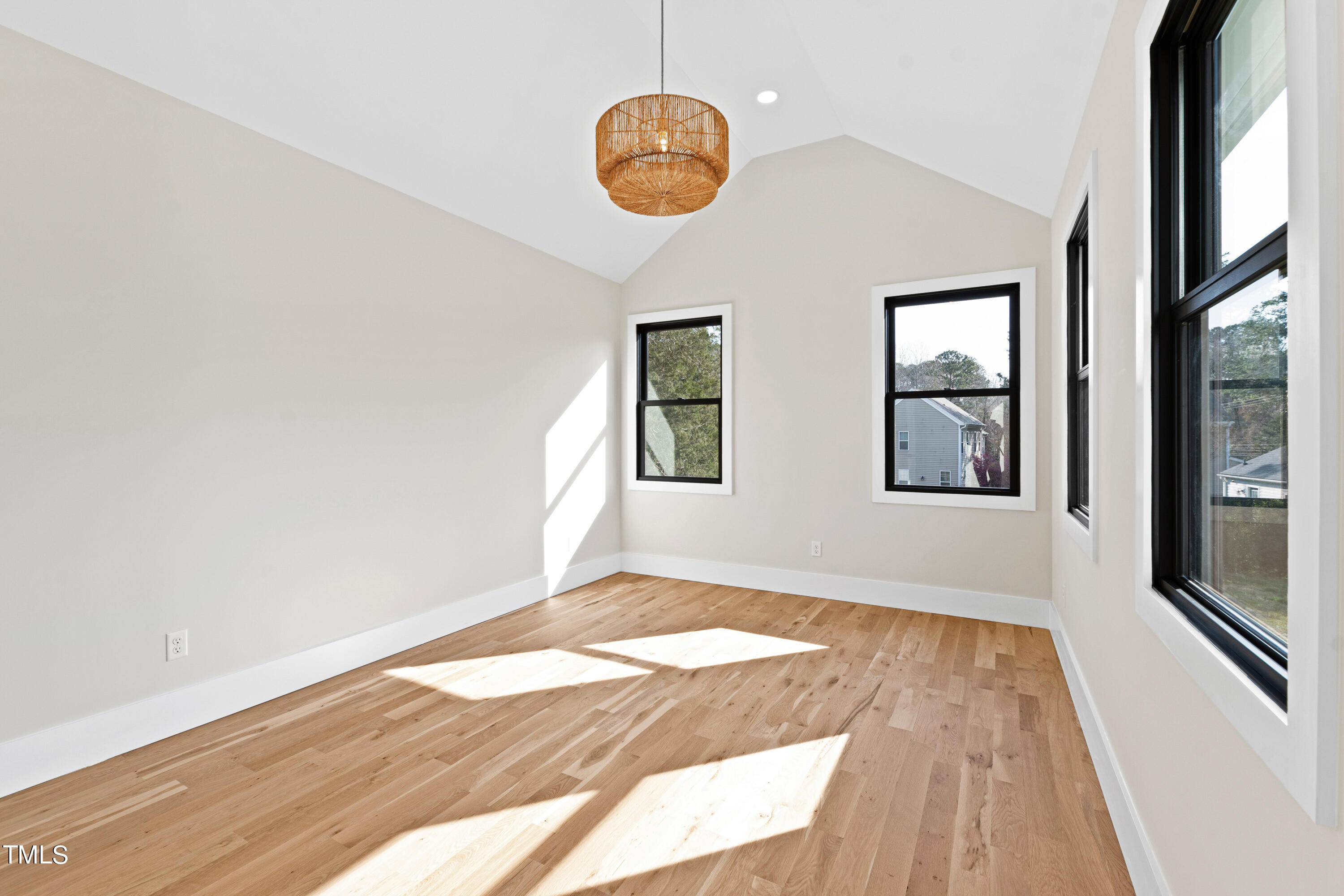 107 Gary Road Carrboro, NC 27510 - Photo 27 of 34 a view of an empty room with wooden floor and a window