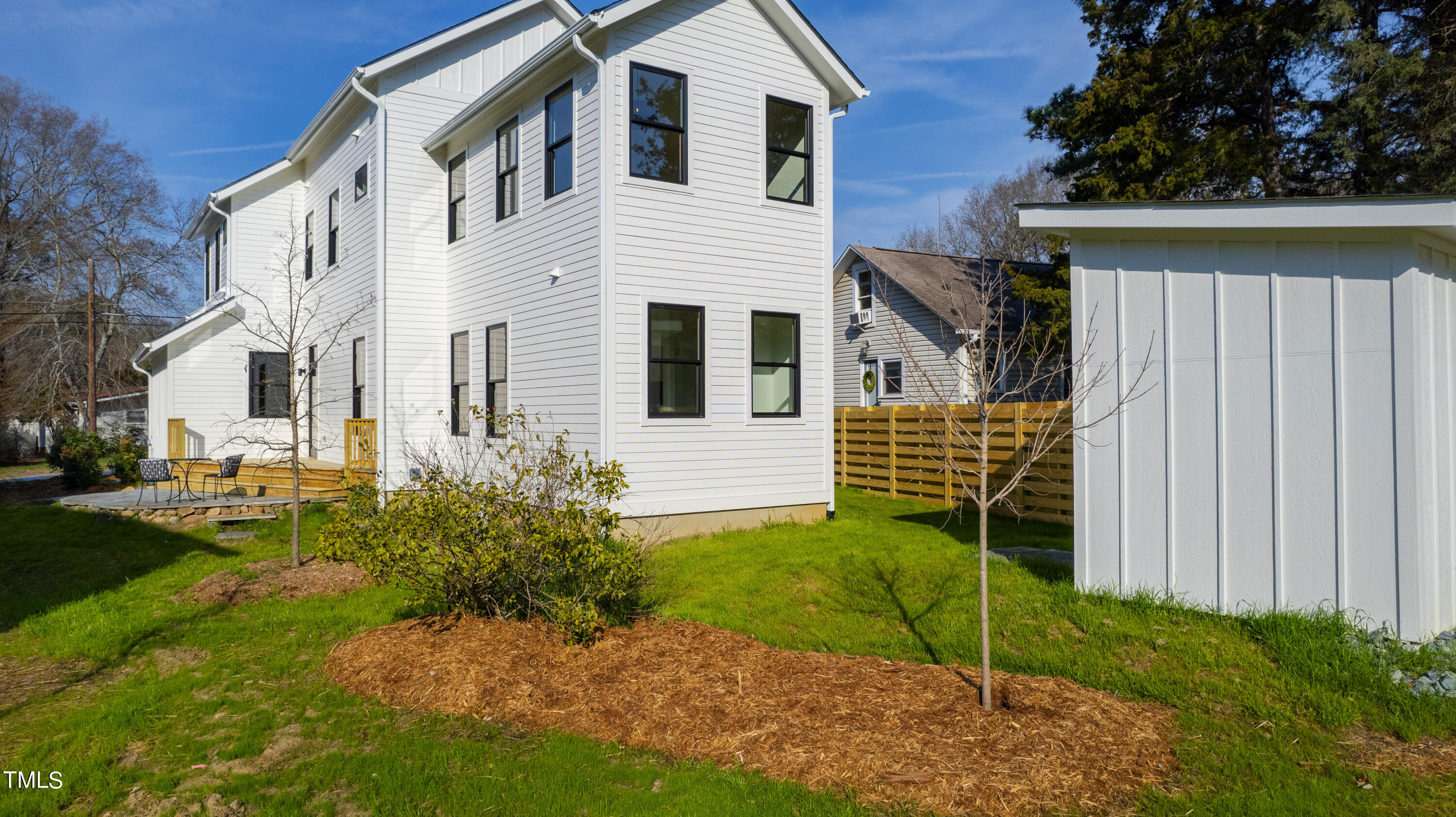 107 Gary Road Carrboro, NC 27510 - Photo 30 of 34 a view of a small house with wooden fence