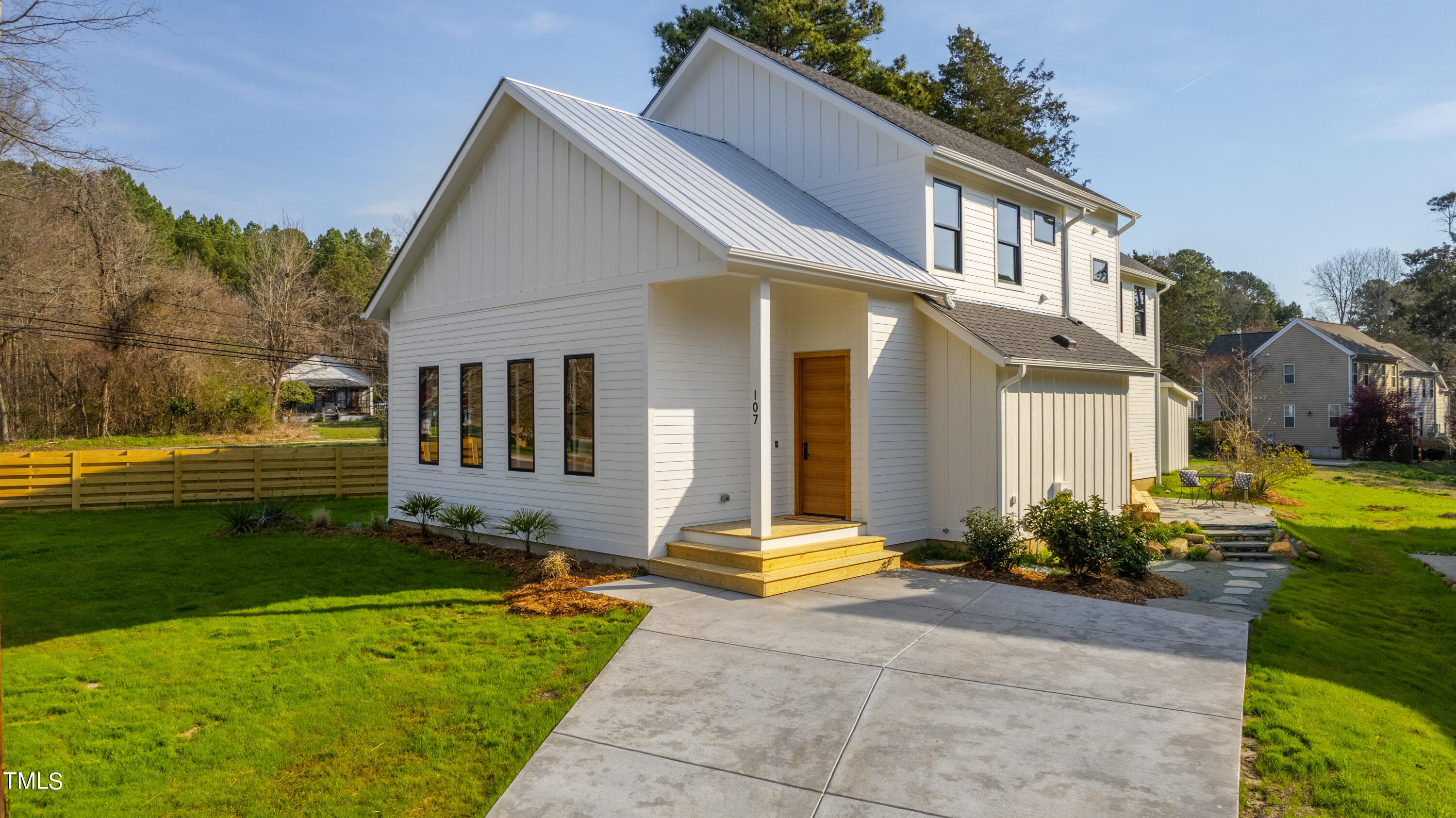 107 Gary Road Carrboro, NC 27510 - Photo 3 of 34 a view of a house with backyard and sitting area