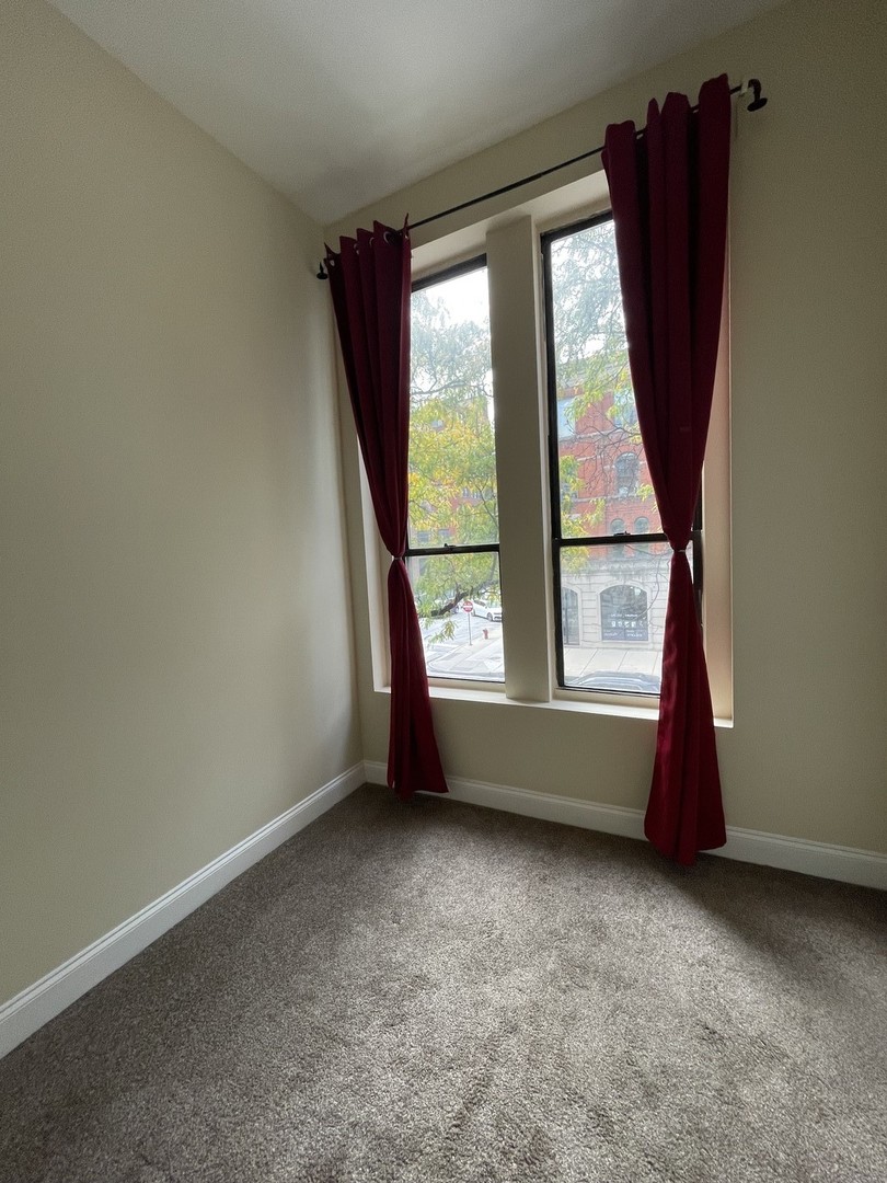 733 North Wells Street, Unit 2 Chicago, IL 60654 - Photo 9 of 12 an empty room with large window