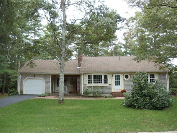41 Yawl Road Barnstable, MA 02655 - Photo 3 of 25 a front view of a house with a garden and porch