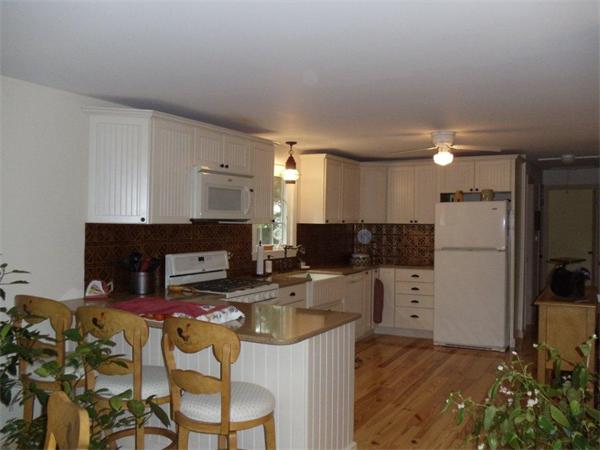 41 Yawl Road Barnstable, MA 02655 - Photo 7 of 25 a kitchen with furniture a refrigerator and a view of living room