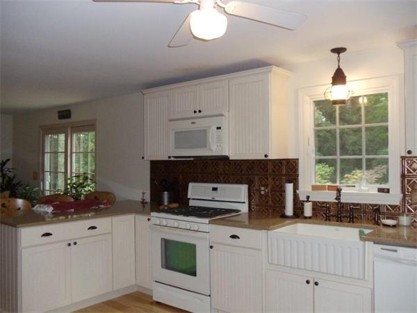 41 Yawl Road Barnstable, MA 02655 - Photo 8 of 25 a kitchen with granite countertop a stove a sink and a refrigerator