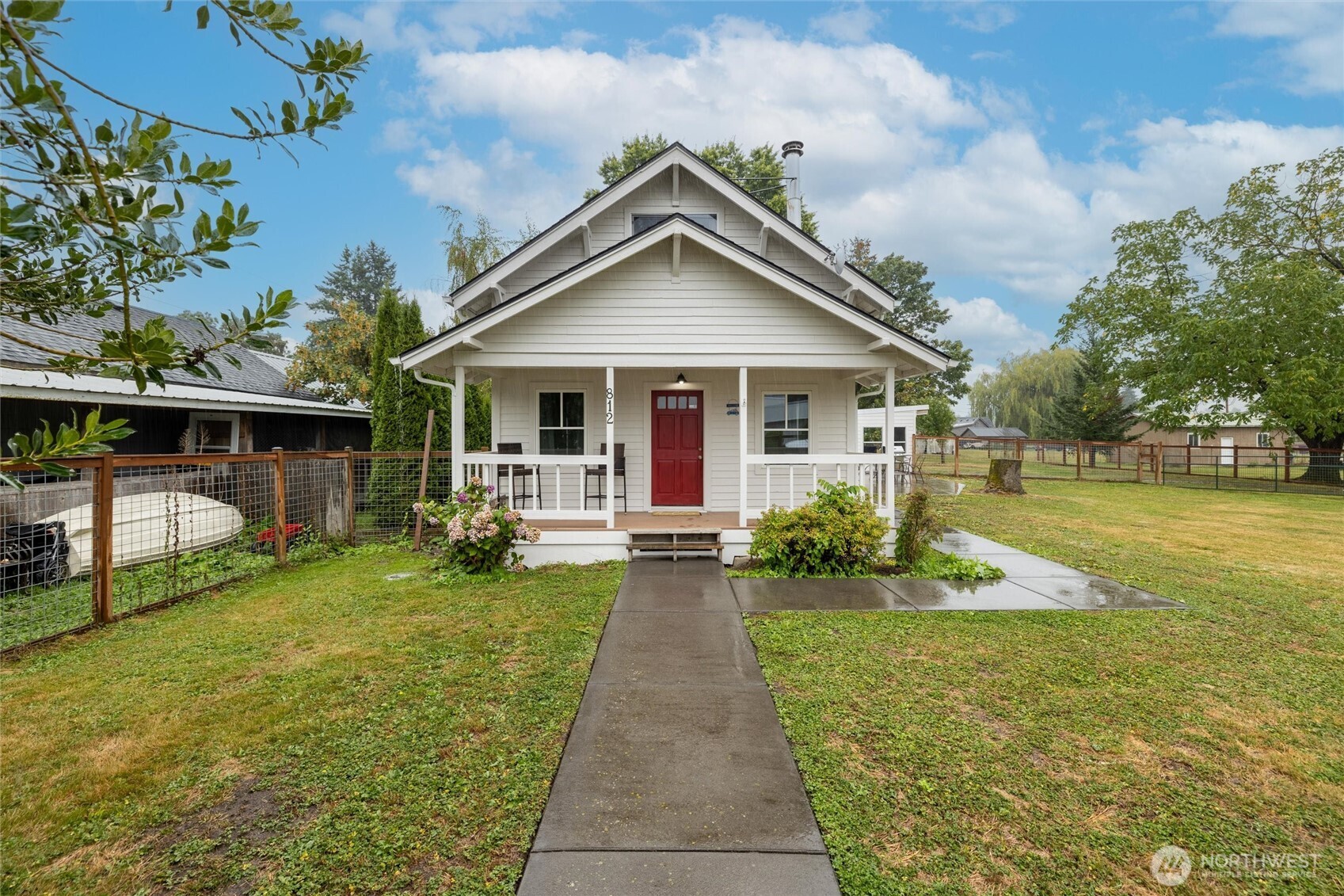 812 Sumas Avenue Sumas, WA 98295 - Photo 1 of 24 a view of a house with a yard porch and sitting area
