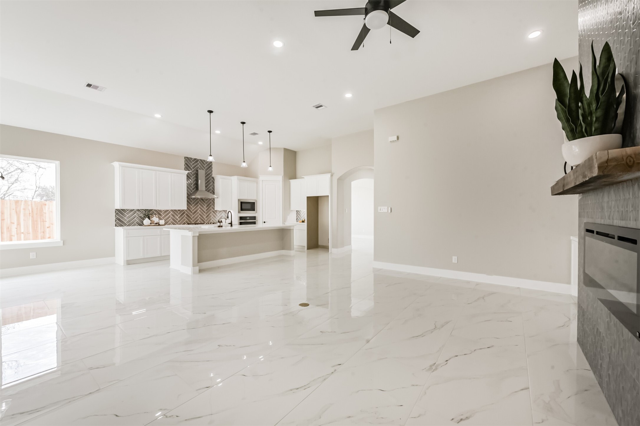 2803 Lancaster Lane Pasadena, TX 77506 - Photo 13 of 45 a view of a kitchen with kitchen island white cabinetry and appliances