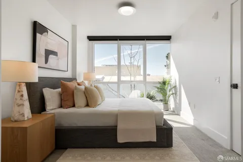 a living room with a couch and a large window