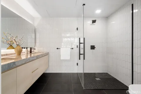 a bathroom with a shower and a sink