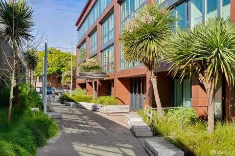 a picture of a bench in front of a wall