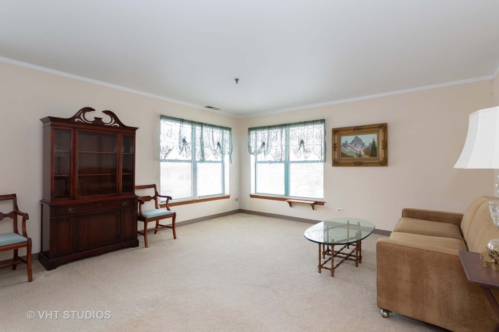3275 Kirchoff Road, Unit 231 Rolling Meadows, IL 60008 - Photo 3 of 12 a living room with furniture and a window