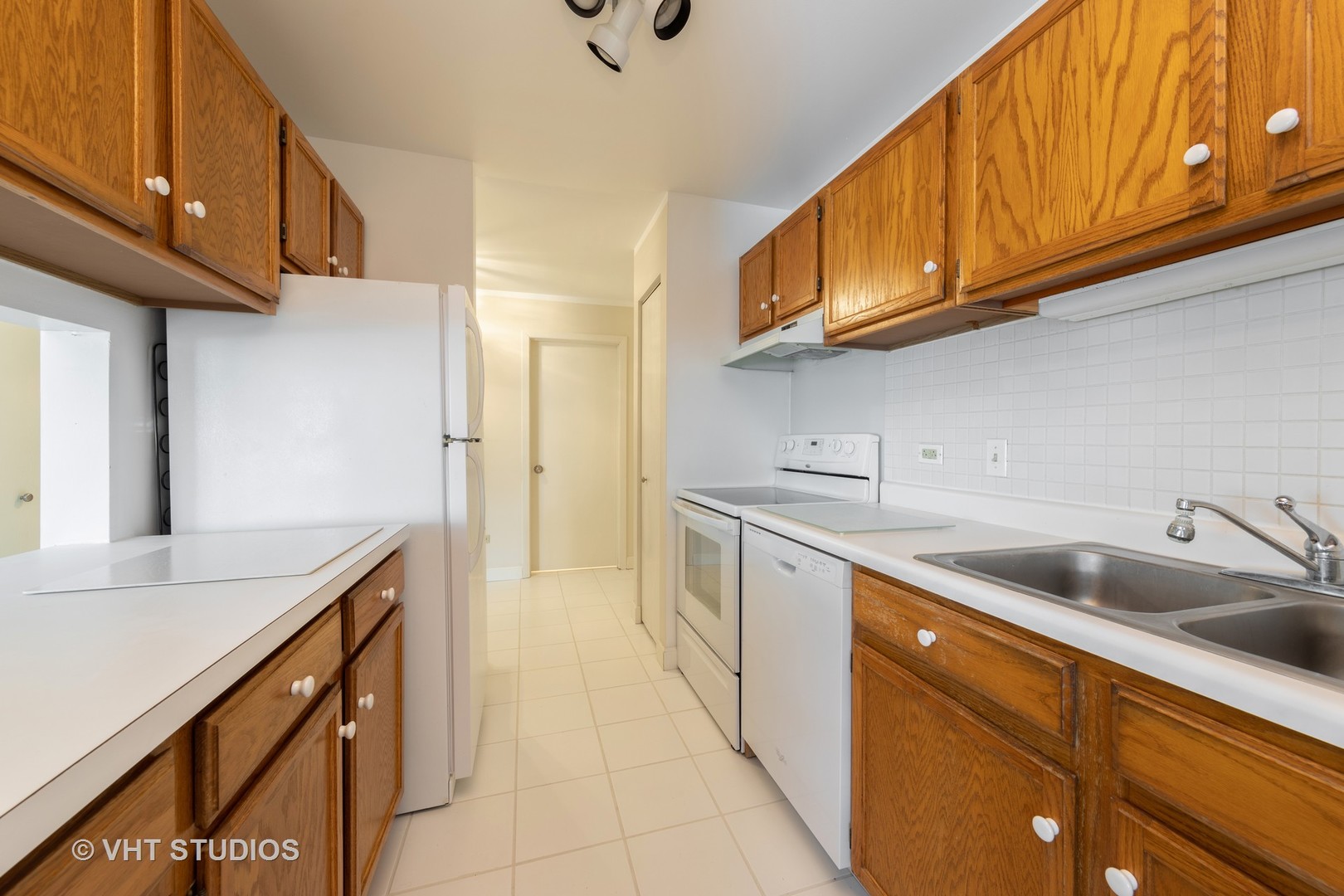 3275 Kirchoff Road, Unit 231 Rolling Meadows, IL 60008 - Photo 5 of 12 a kitchen with stainless steel appliances granite countertop a sink and cabinets