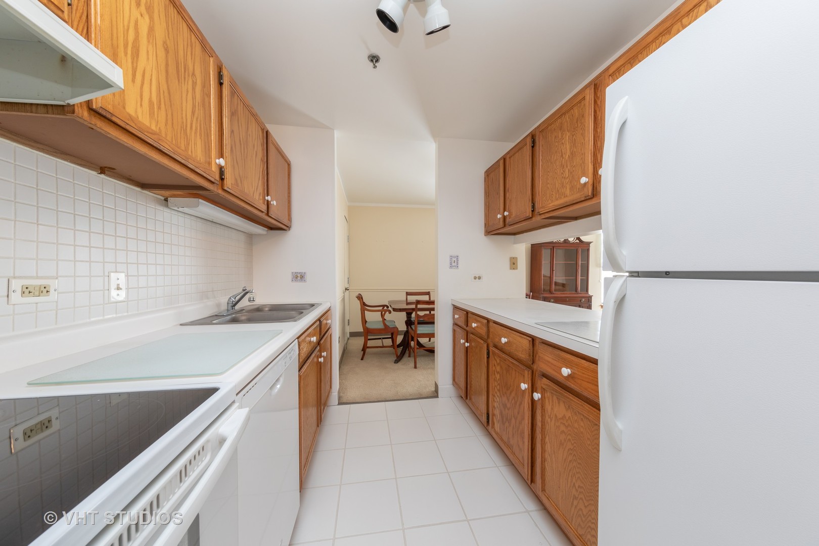 3275 Kirchoff Road, Unit 231 Rolling Meadows, IL 60008 - Photo 6 of 12 a kitchen with stainless steel appliances granite countertop a sink and cabinets