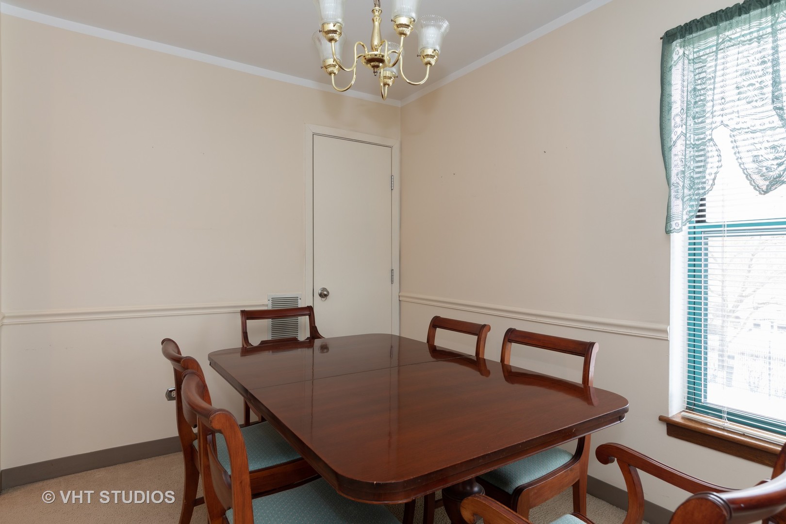 3275 Kirchoff Road, Unit 231 Rolling Meadows, IL 60008 - Photo 7 of 12 a view of a dining room with furniture and window