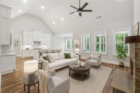 a living room with furniture and a large window