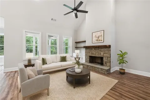 a living room with furniture and a fireplace