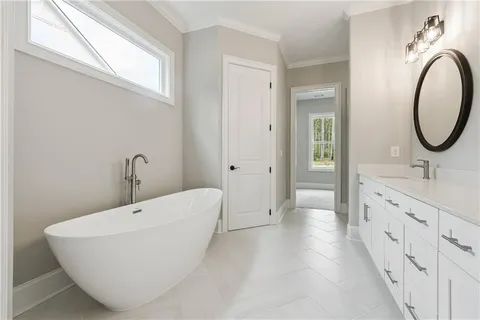 a bathroom with 2 sink tub and a mirror