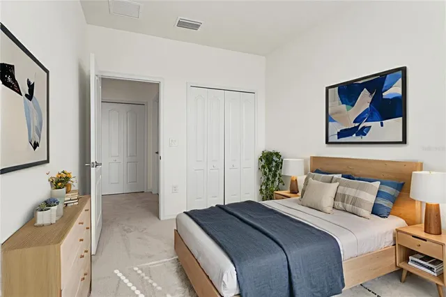 a bedroom with a bed and a view of bathroom