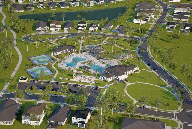 an aerial view of a pool yard swimming pool and outdoor seating