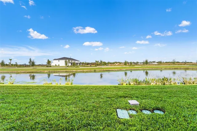 a view of a swimming pool with a table and chairs