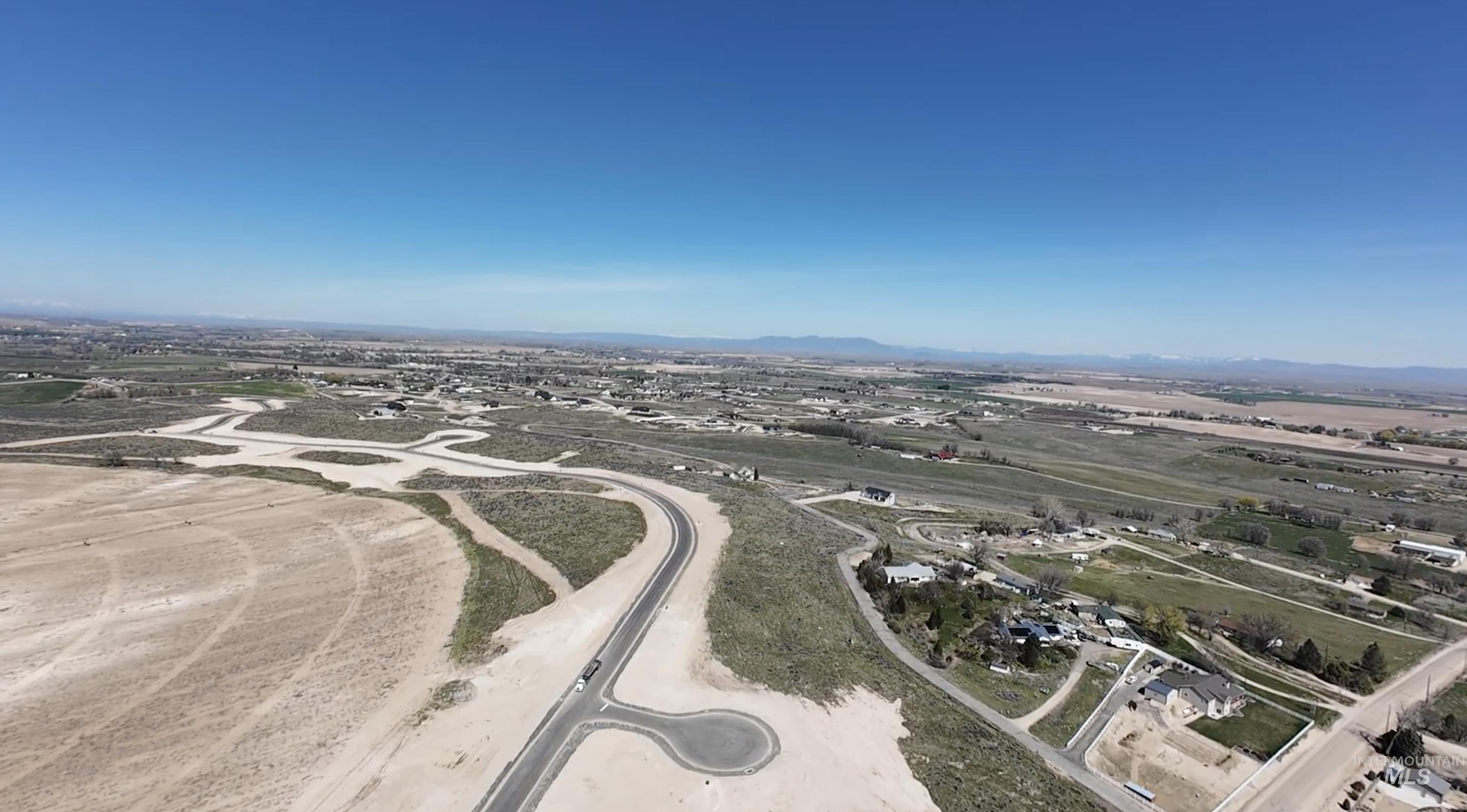 27528 Commerce Comet Way Caldwell, ID 83607 - Photo 16 of 18 Aerial overview of property's location featuring a mountain backdrop