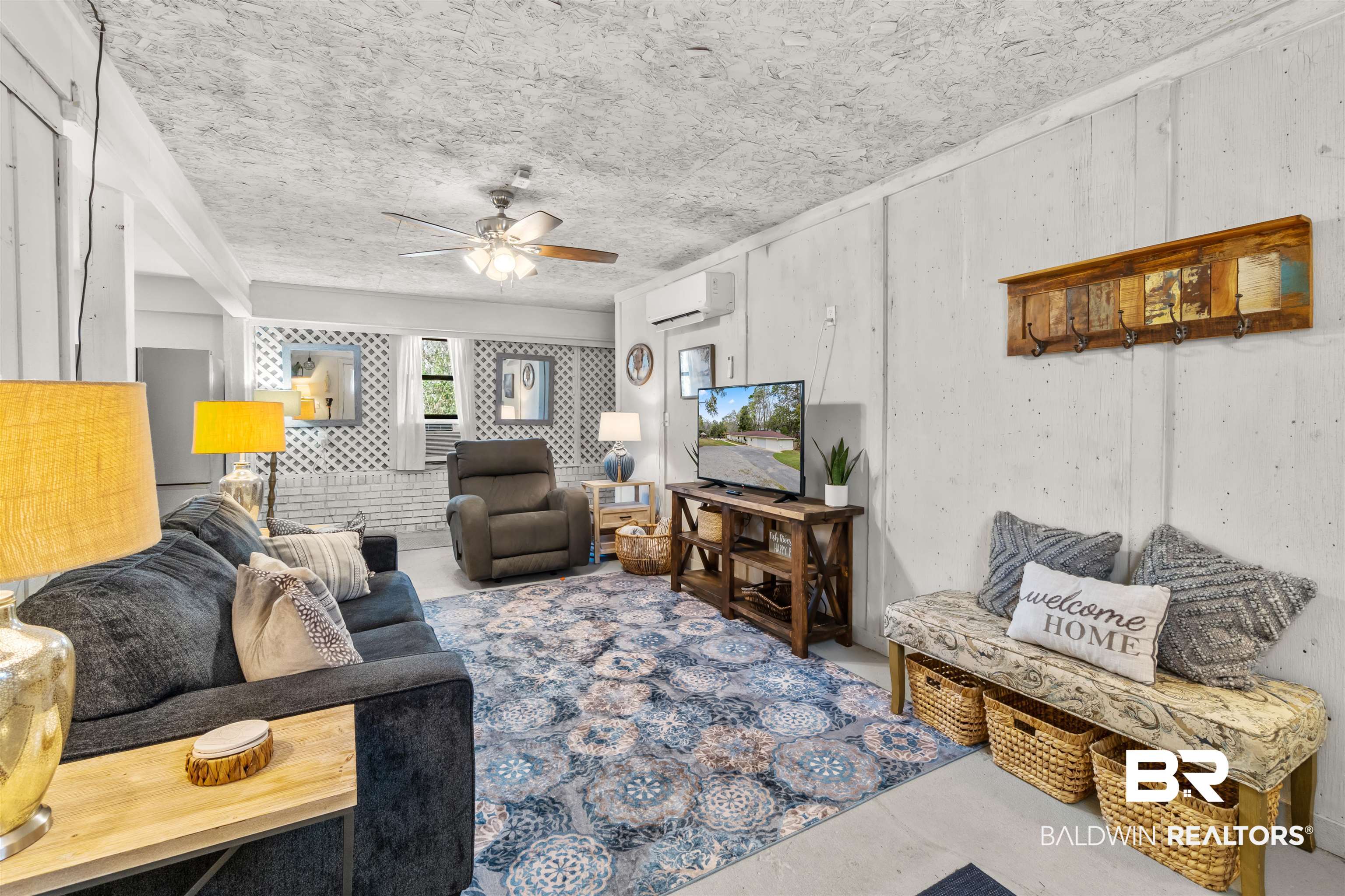 17595 River Road Summerdale, AL 36580 - Photo 5 of 29 Living room with concrete floors, ceiling fan, and a mini split for heating / cooling