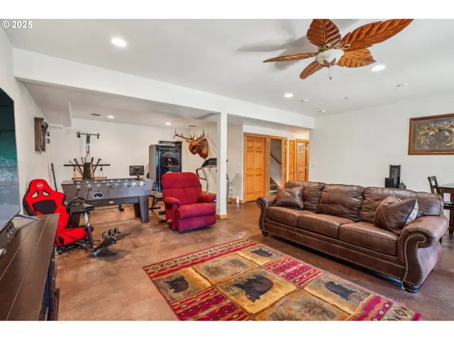 a living room with furniture and kitchen view