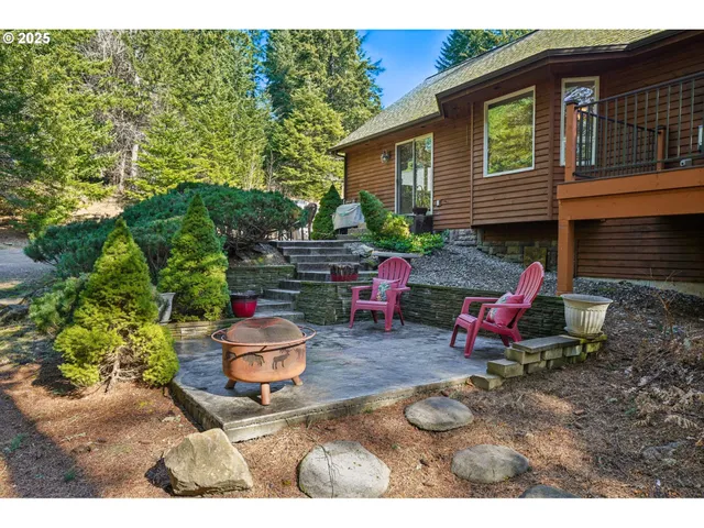 a backyard of a house with outdoor seating