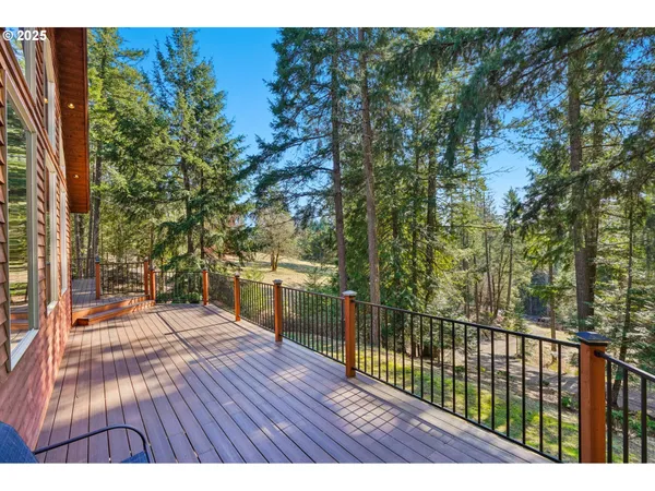 a view of a balcony with wooden floor
