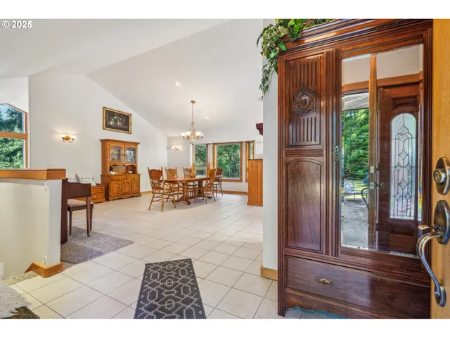 a view of living room filled with furniture and a window