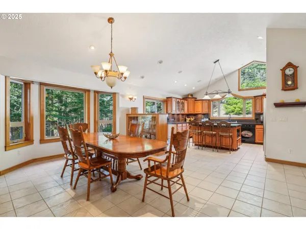 a dining room with a table and chairs