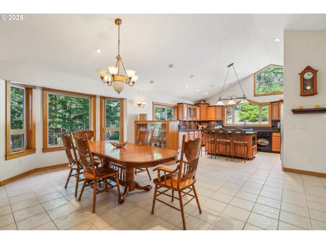 a dining room with a table and chairs