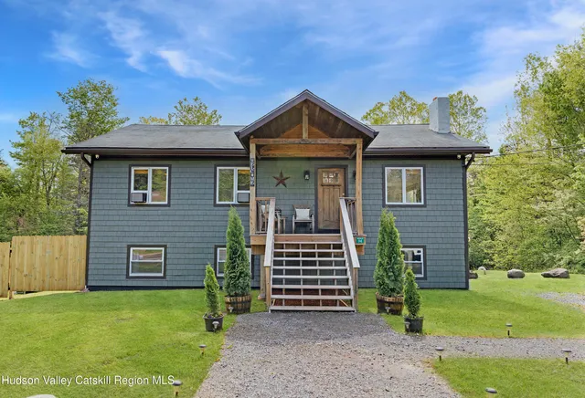 a front view of a house with garden