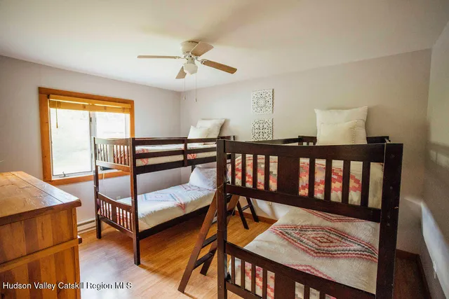 a bedroom with furniture and a window