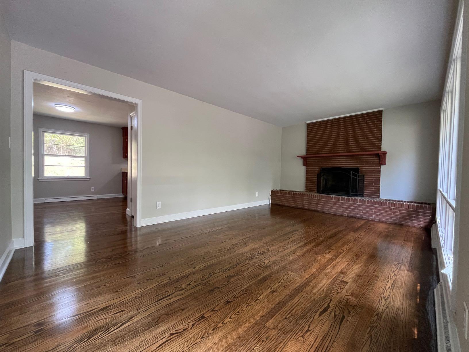 2548 Beverly Boulevard Southwest Roanoke, VA 24015 - Photo 17 of 17 a view of empty room with wooden floor and fireplace