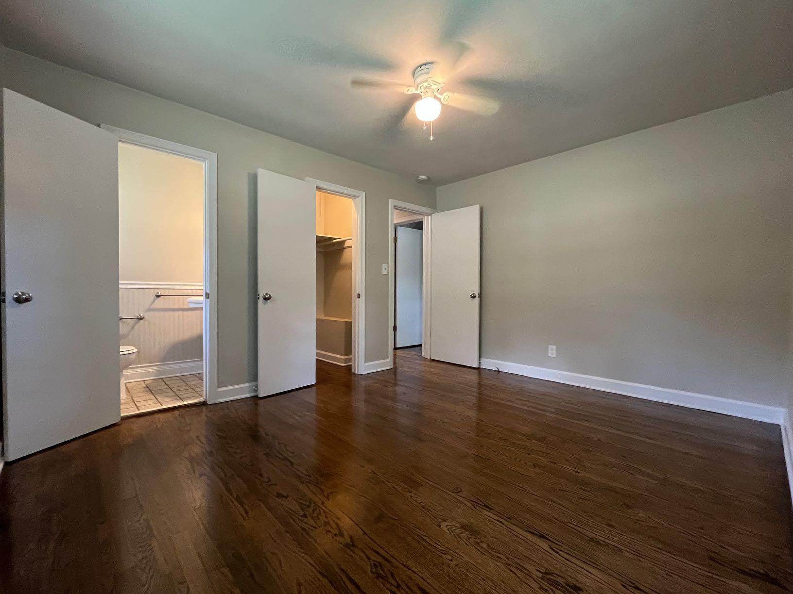 2548 Beverly Boulevard Southwest Roanoke, VA 24015 - Photo 9 of 17 an empty room with wooden floor and windows