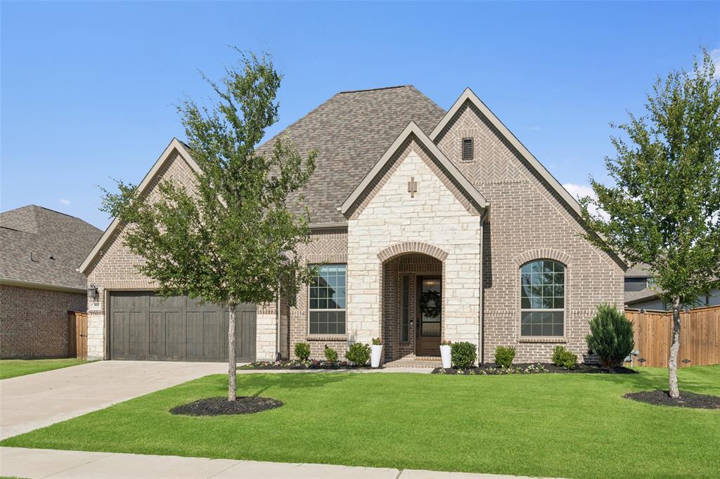 931 Thistle Road Prosper, TX 75078 - Photo 1 of 1 a front view of a house with a yard