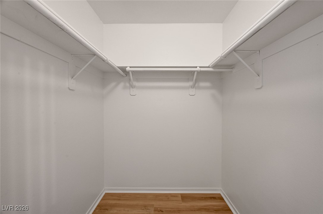 9050 West Warm Springs Road, Unit 1164 Las Vegas, NV 89148 - Photo 13 of 52 Walk in closet in primary bedroom