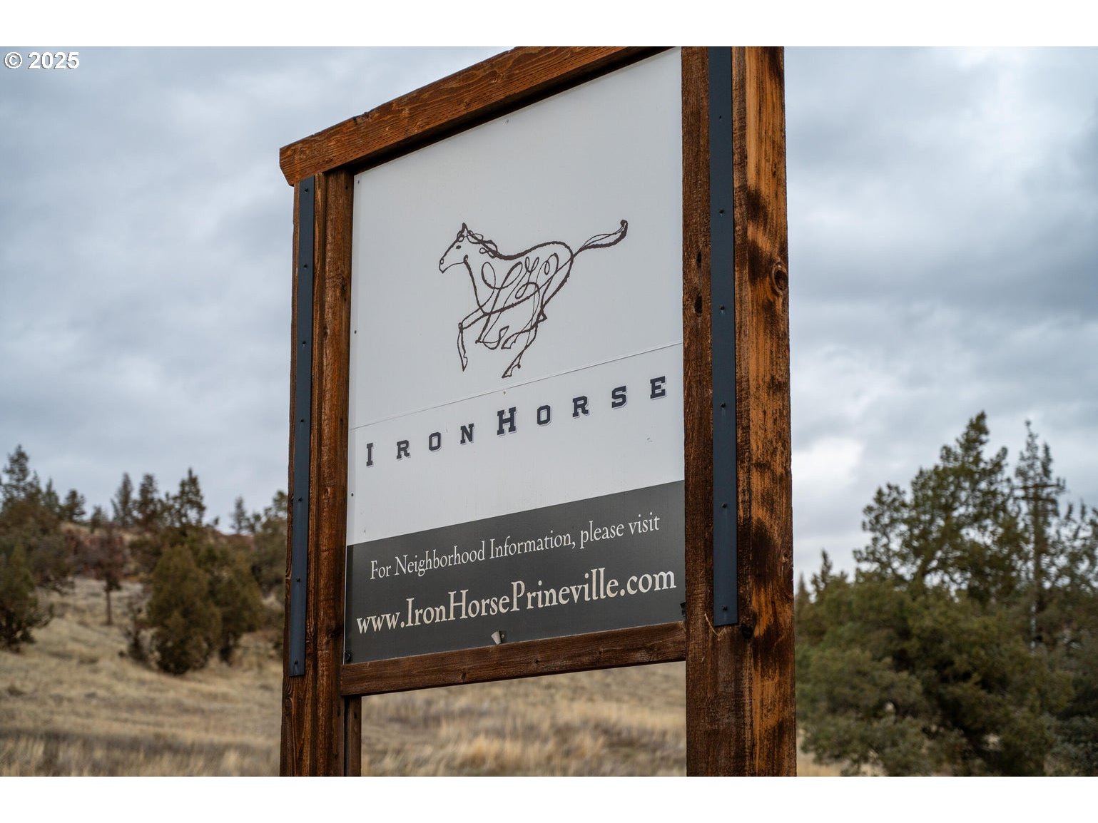 Northeast Compass Court, Unit TL600 Prineville, OR 97754 - Photo 14 of 14 a sign on the side of a building