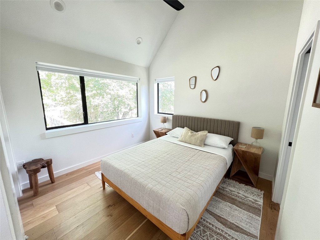 1100 Brass Street, Unit 2 Austin, TX 78702 - Photo 12 of 27 a bedroom with a bed and window