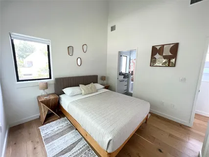 a bedroom with a bed and a table