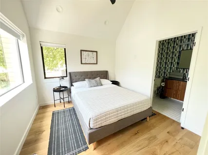 a bedroom with a bed and a table in it