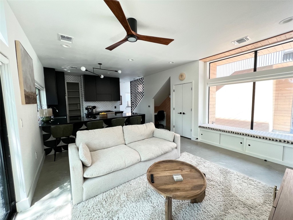 1100 Brass Street, Unit 2 Austin, TX 78702 - Photo 3 of 27 a living room with furniture and a large window