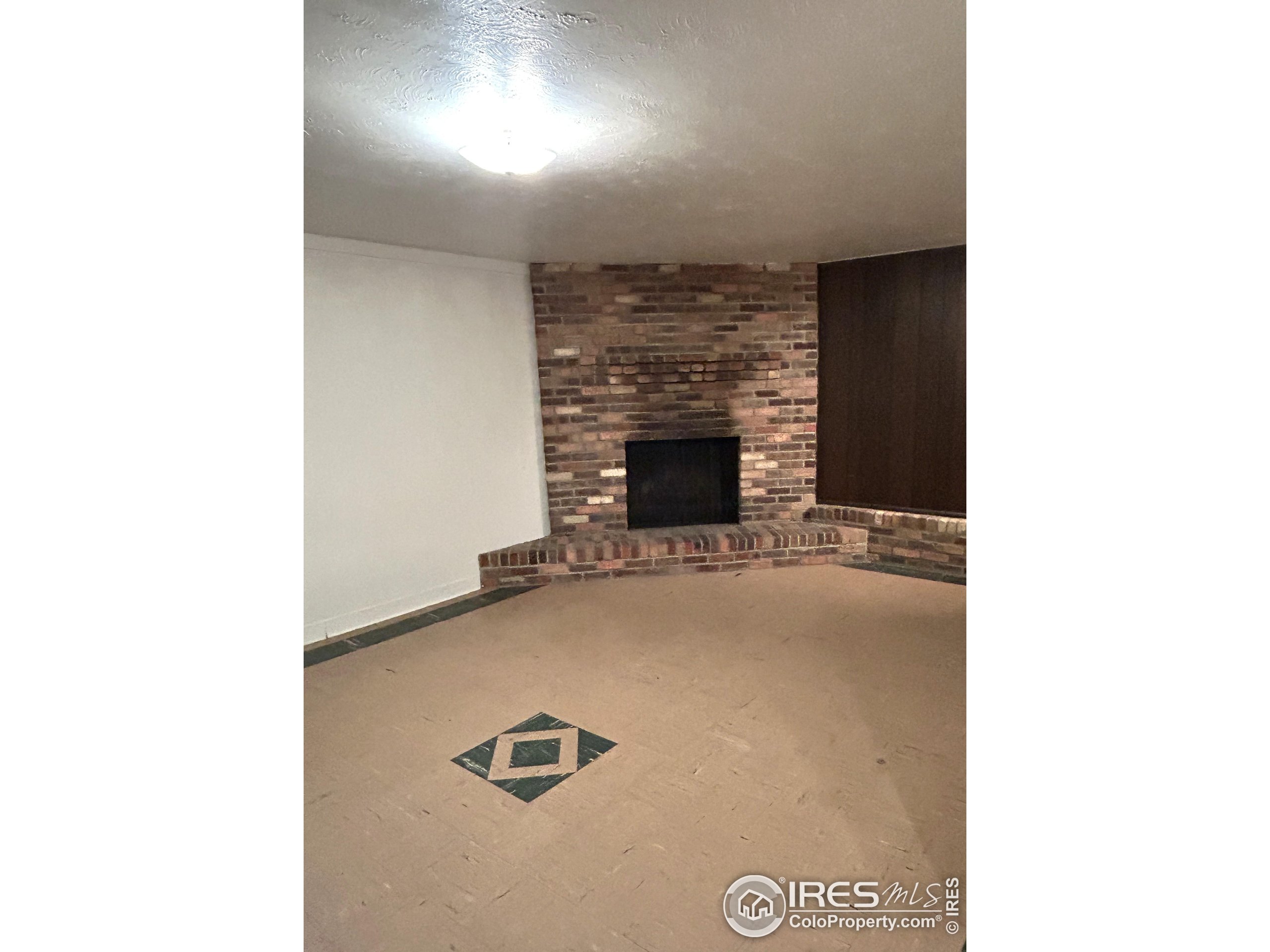 123 Balsam Street Fort Morgan, CO 80701 - Photo 21 of 34 a view of livingroom with furniture and fireplace
